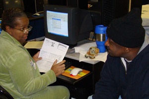 Carolyn Husband prepares Jeffrey Flournoy's taxes. Mr. Flournoy is an Auburn Gresham resident.