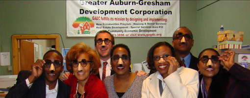 GADC Staff and Quest Development LLC smile with the classic Groucho Marx glasses.