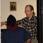 Librarian Jan Brooks gives instruction to one of his team members on how to assist GADC with the Senior Breakfast-n-Blues Festival.