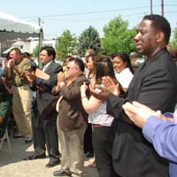 NCP lead agencies Greater Southwest Community Development Corp., Garfield Park Conservatory Alliance, Bikerdike Redevelopment Corp., and others clapped to Jonathan Fanton's announcement.