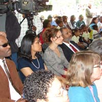 Teamwork Englewood, Woodlawn Preservation and Investment Corp., Greater Southwest CDC, Center for Economic Progress, and Quad Communities Development Corp. representatives all listen attentively to distinguished panel of speakers.